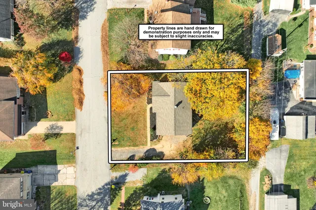 a view of a door and flowers