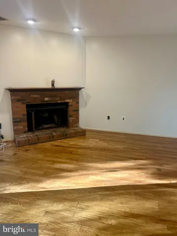 a view of wooden floor and a fireplace