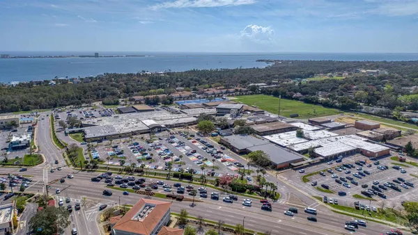 an aerial view of residential building and lake