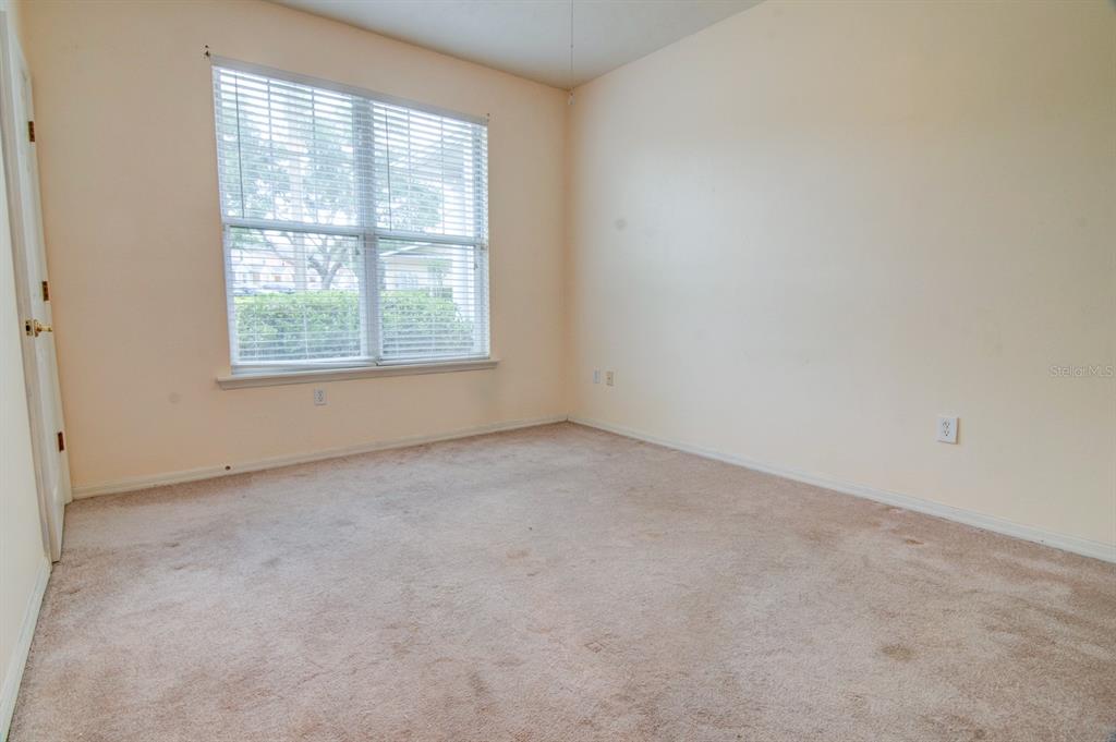 1563 Northwest 29 Road, Unit 108 Gainesville, FL 32605 - Photo 13 of 25 an empty room with a window