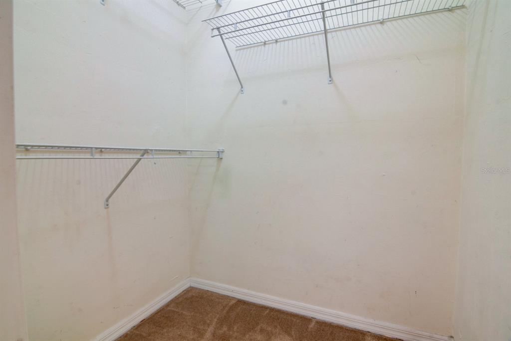 1563 Northwest 29 Road, Unit 108 Gainesville, FL 32605 - Photo 15 of 25 a view of small space with racks on the wall