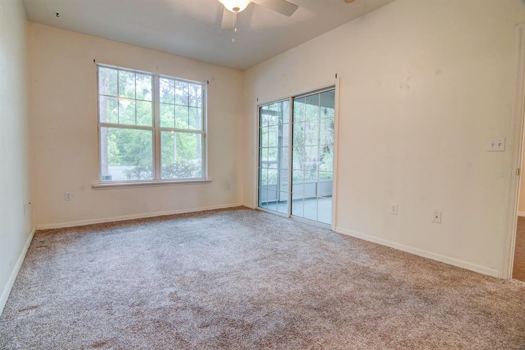 1563 Northwest 29 Road, Unit 108 Gainesville, FL 32605 - Photo 17 of 25 an empty room with windows