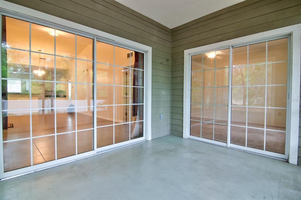 1563 Northwest 29 Road, Unit 108 Gainesville, FL 32605 - Photo 24 of 25 a view of an empty room with a window