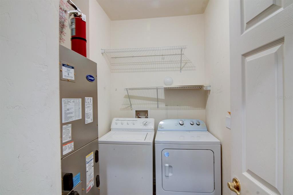 1563 Northwest 29 Road, Unit 108 Gainesville, FL 32605 - Photo 10 of 25 a utility room with dryer and washer