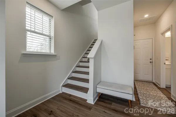 a view of entryway with wooden floor