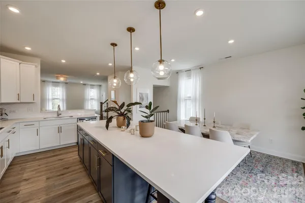 a kitchen with sink and stove
