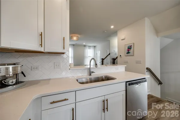 a kitchen with a sink and cabinets