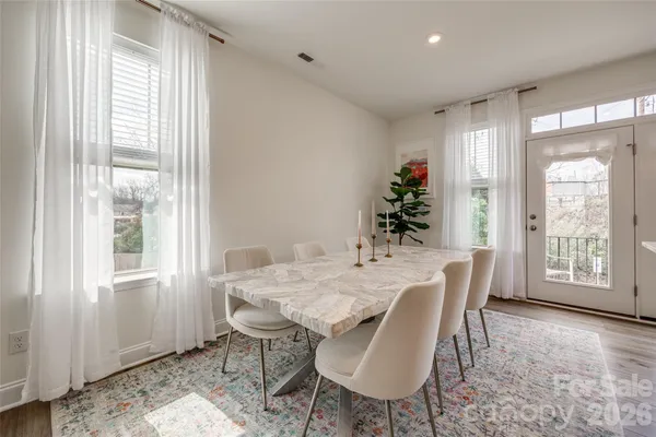 a view of a dining room with furniture window and outside view