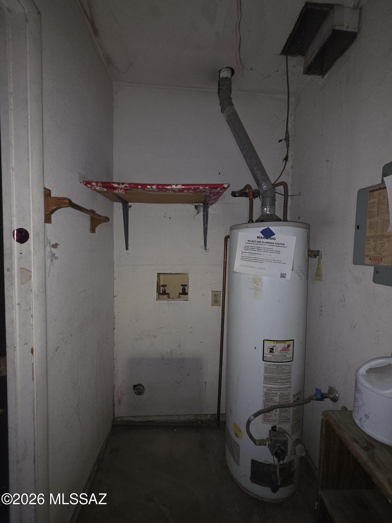 211 West Roger Road, Unit 24 Tucson, AZ 85705 - Photo 17 of 24 a bathroom with a refrigerator and a sink