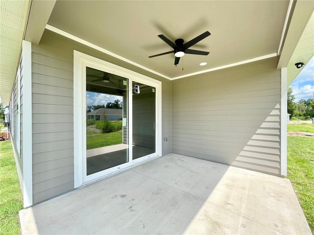 1021 Southwest 67th Street Gainesville, FL 32607 - Photo 32 of 53 a view of a big room with wooden floor and windows