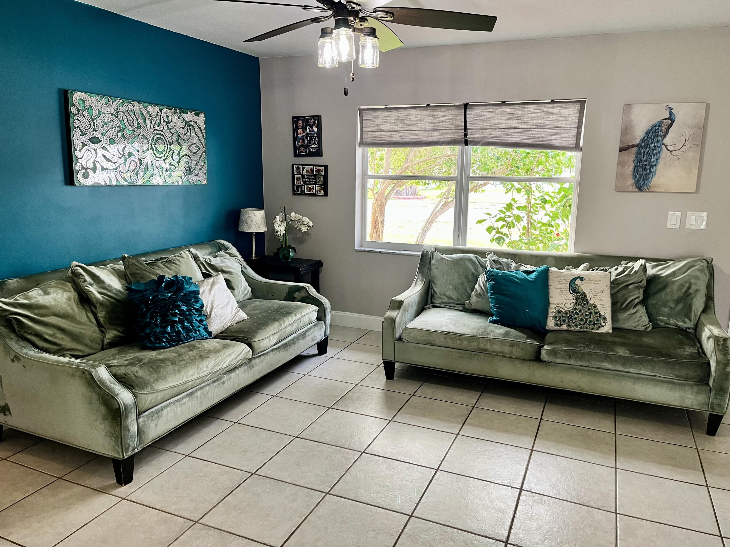 4730 Betelnut Street Boca Raton, FL 33428 - Photo 14 of 42 a living room with furniture and a window