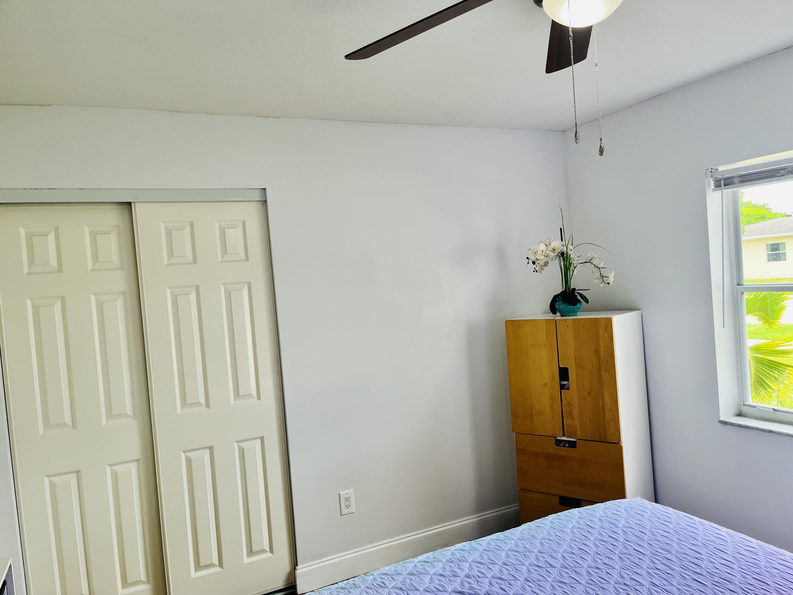 4730 Betelnut Street Boca Raton, FL 33428 - Photo 22 of 42 a view of a bedroom