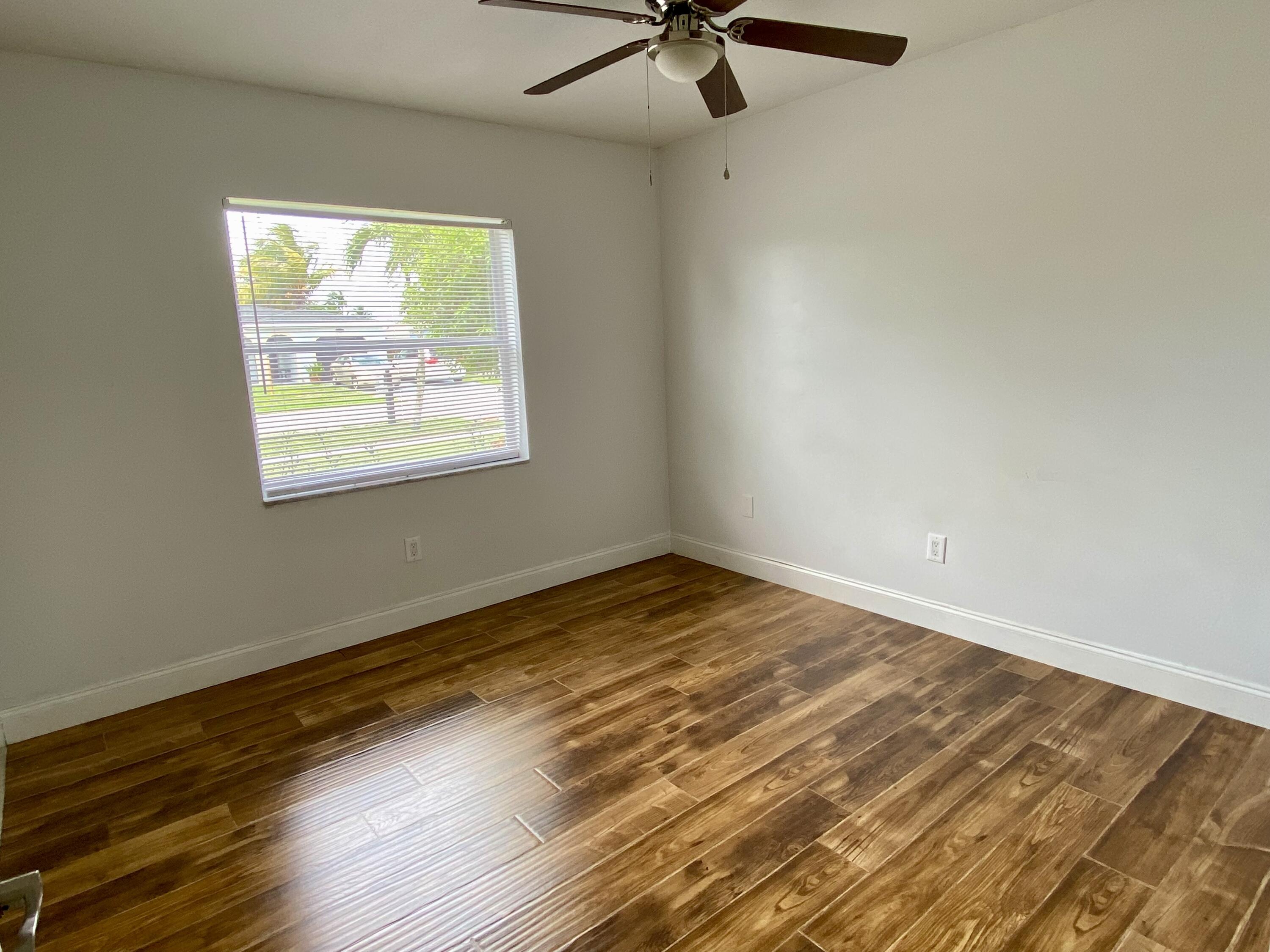 4730 Betelnut Street Boca Raton, FL 33428 - Photo 23 of 42 an empty room with a window