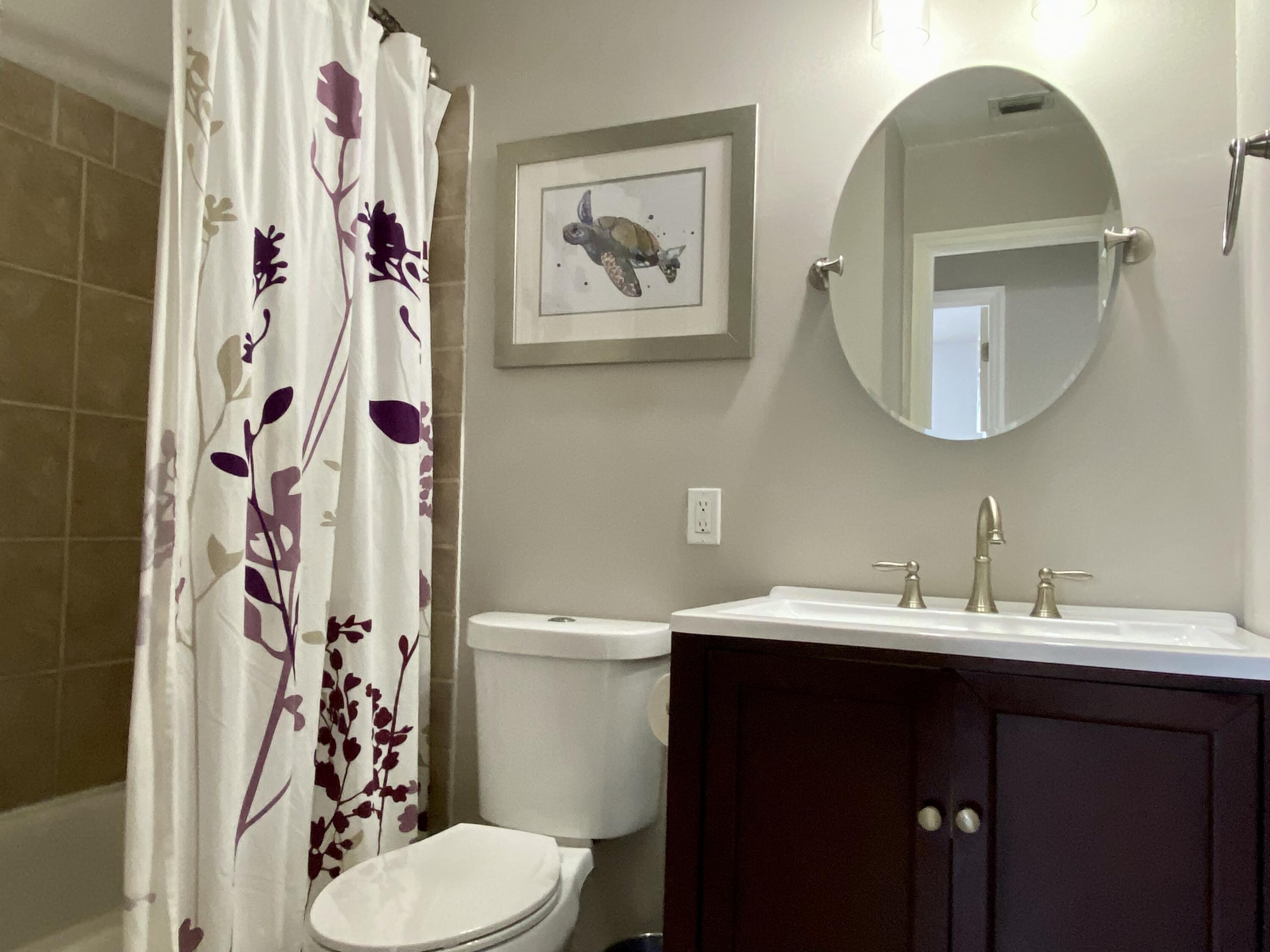 4730 Betelnut Street Boca Raton, FL 33428 - Photo 27 of 42 a bathroom with a sink and a mirror