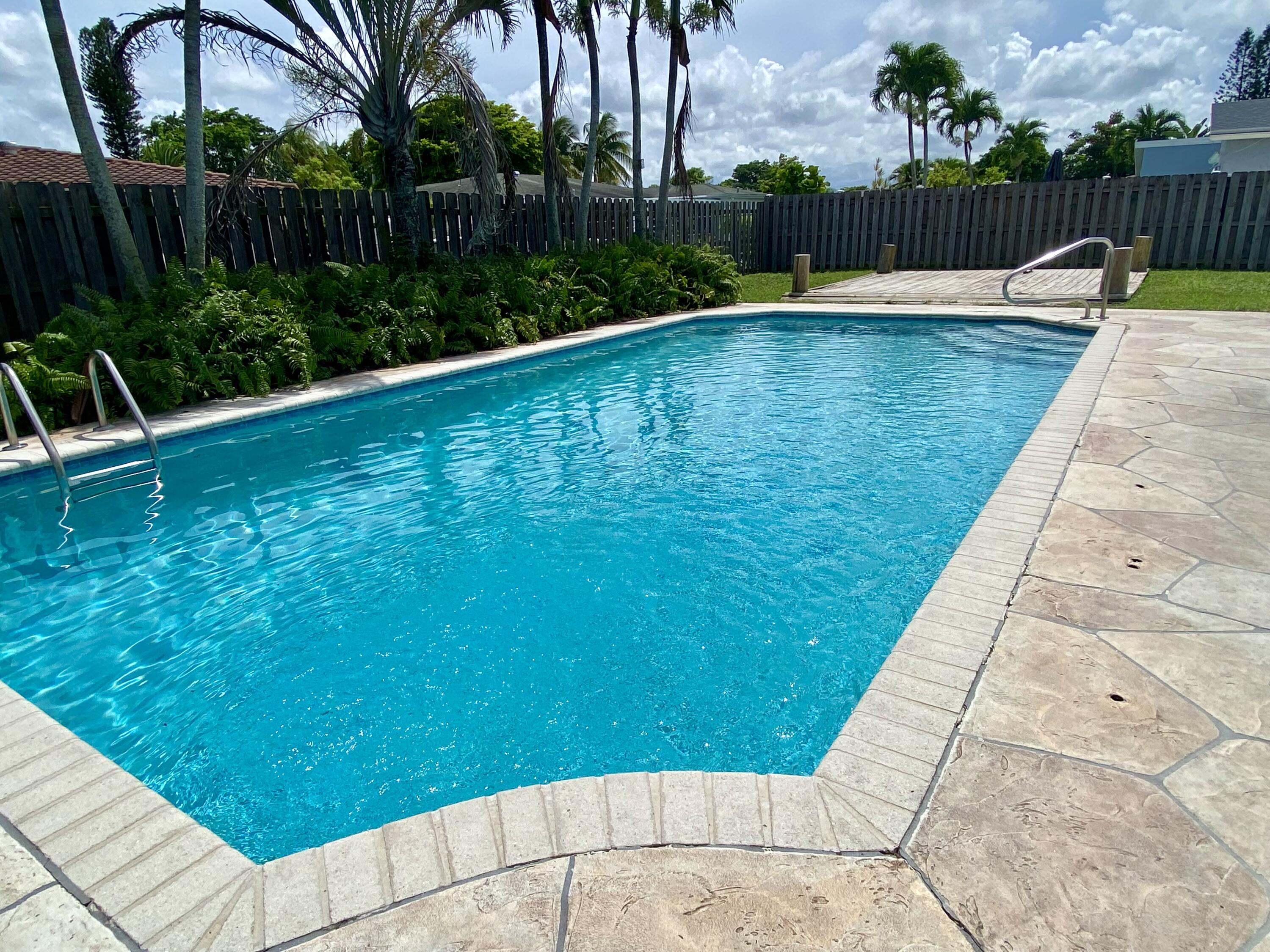 4730 Betelnut Street Boca Raton, FL 33428 - Photo 30 of 42 a view of swimming pool with a patio