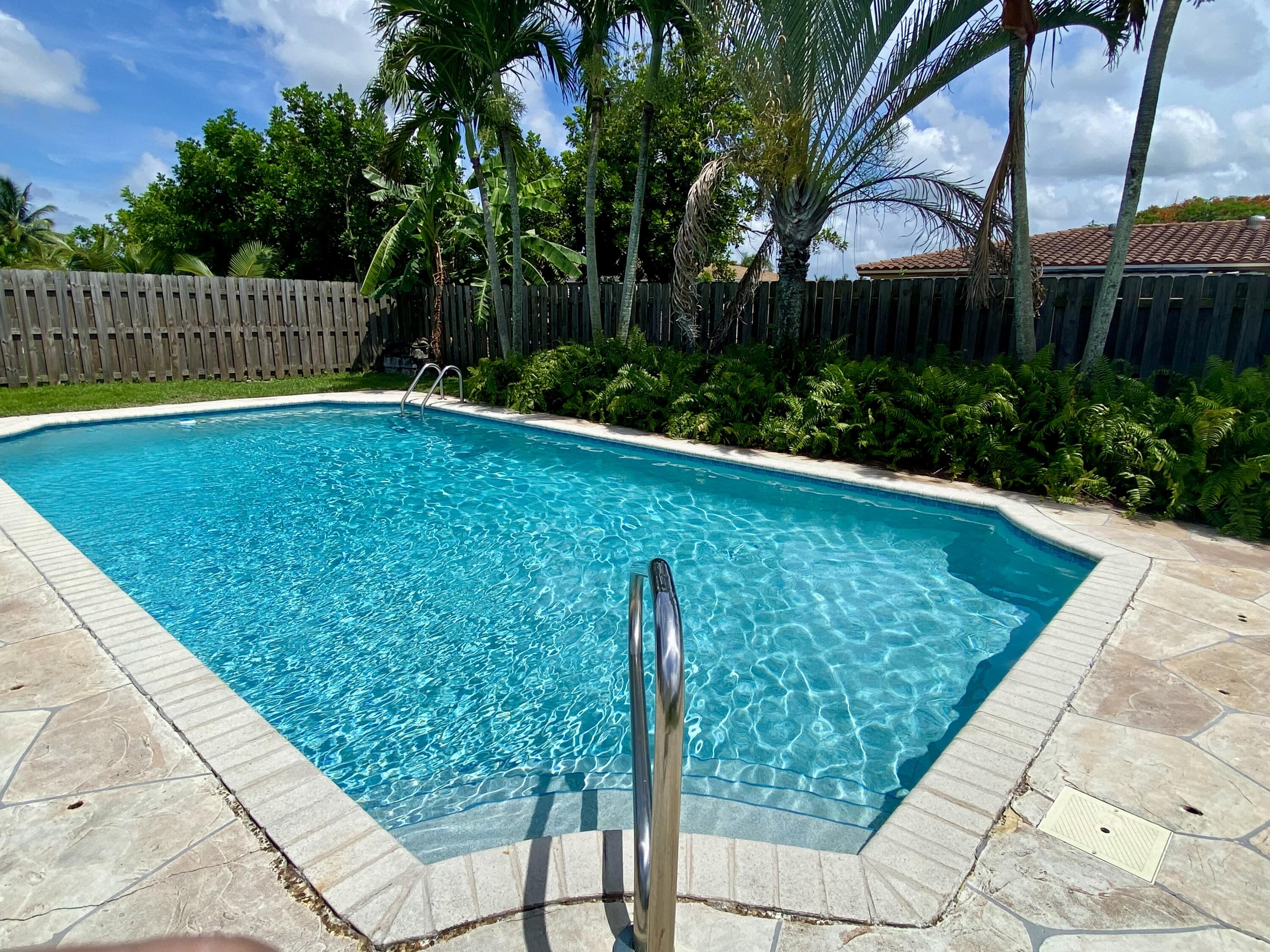 4730 Betelnut Street Boca Raton, FL 33428 - Photo 3 of 42 a view of a backyard