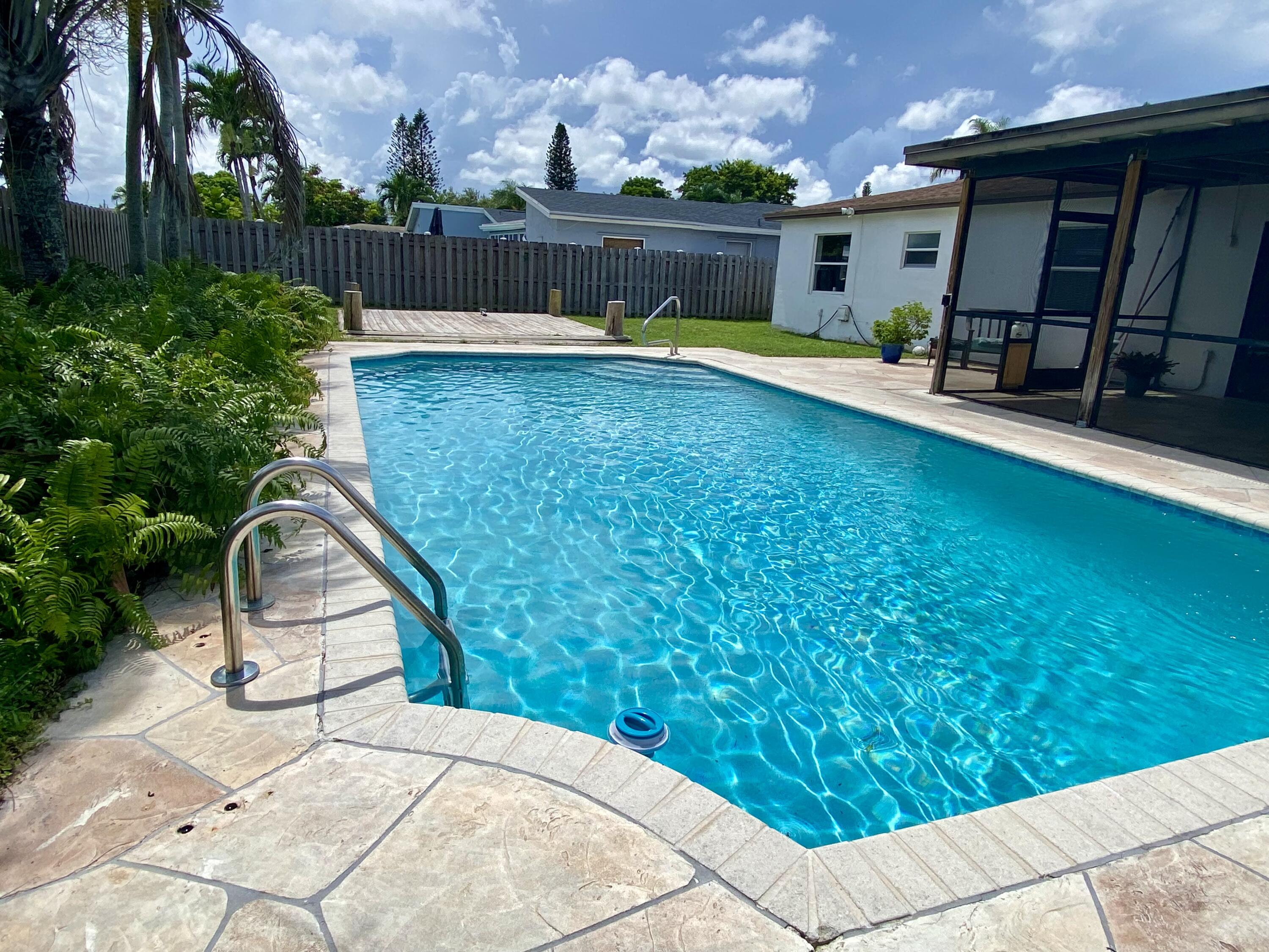 4730 Betelnut Street Boca Raton, FL 33428 - Photo 31 of 42 a view of a backyard with sitting area