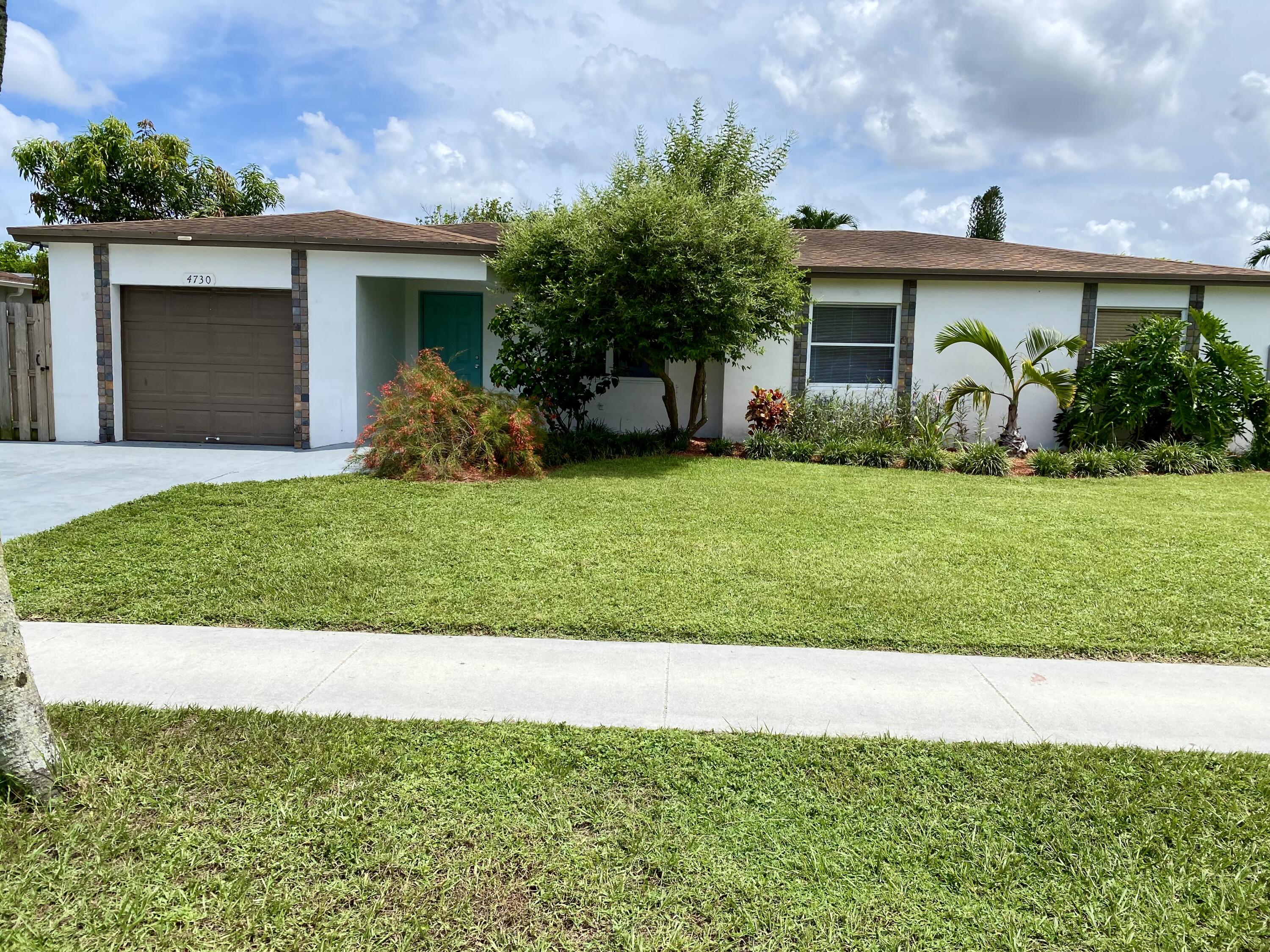 4730 Betelnut Street Boca Raton, FL 33428 - Photo 38 of 42 a view of a house with backyard