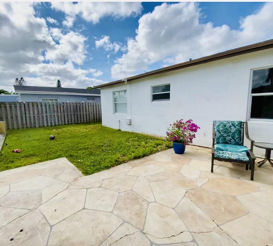4730 Betelnut Street Boca Raton, FL 33428 - Photo 6 of 42 a view of a backyard with sitting area