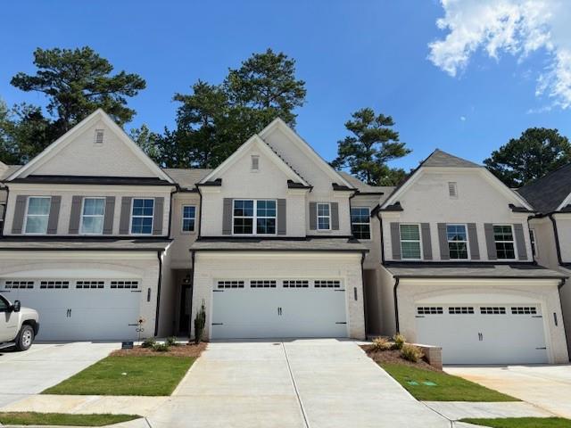 4220 Cavalier Way Duluth, GA 30097 - Photo 1 of 1 a front view of a house with a garden