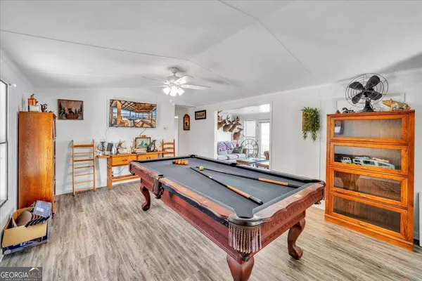 a room with furniture and wooden floor