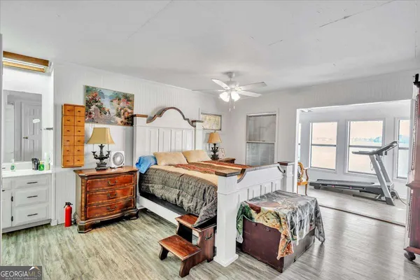 a bedroom with a bed and window