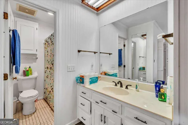 a bathroom with a sink double vanity and a mirror