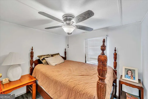a bathroom with a sink mirror vanity and toilet
