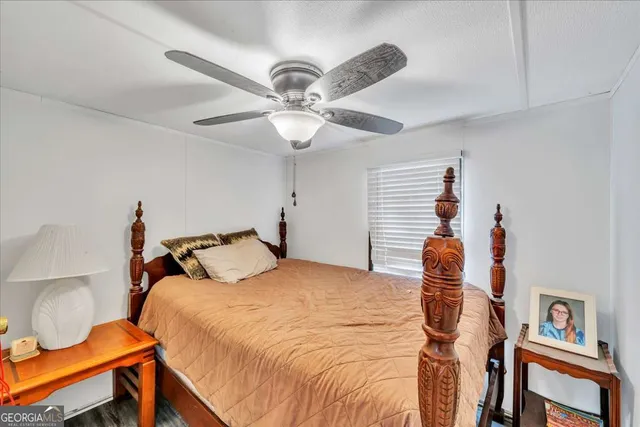 a bathroom with a sink mirror vanity and toilet