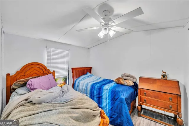 a view of a dining room with furniture wooden floor and a rug