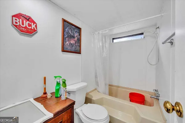 a kitchen with a refrigerator and a stove top oven