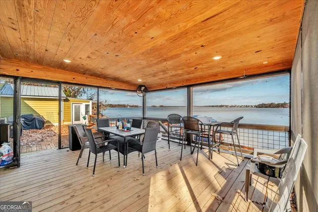 a patio with patio outdoor seating and wooden floor