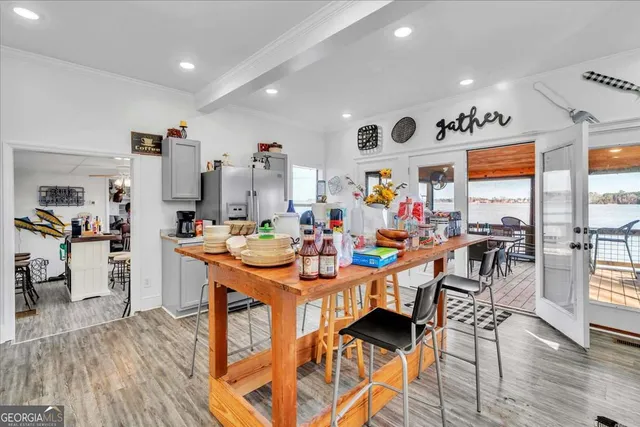 an aerial view of a house with swimming pool and porch with furniture