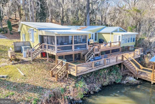 a small pool with lawn chairs