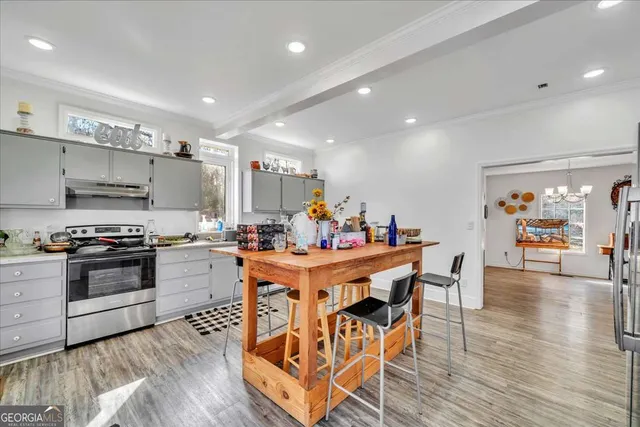a view of a dining room with furniture and wooden floor