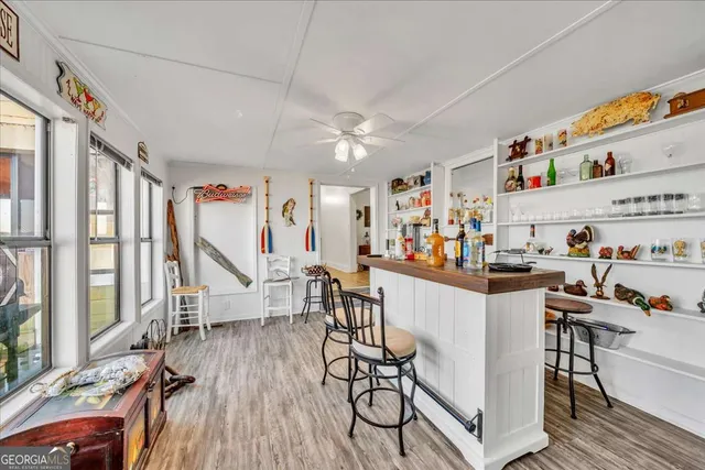 a living room with furniture a rug and a chandelier