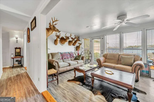 a room with pool table and window