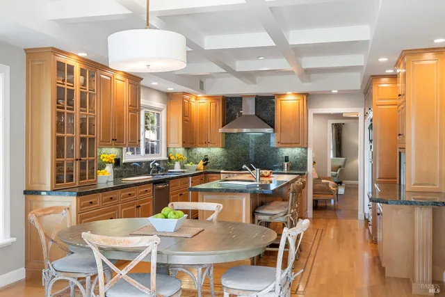 a view of a dining room with furniture large windows and wooden floor