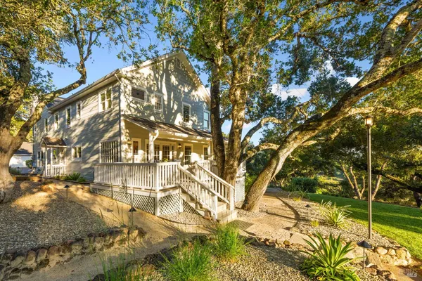 a view of a patio with a table chairs and backyard