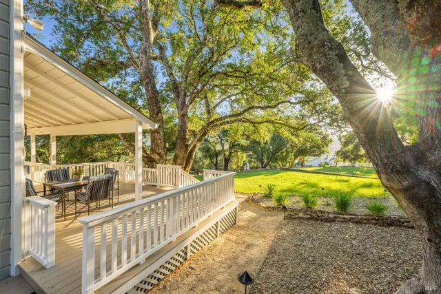 a spacious bathroom with a granite countertop sink and a mirror