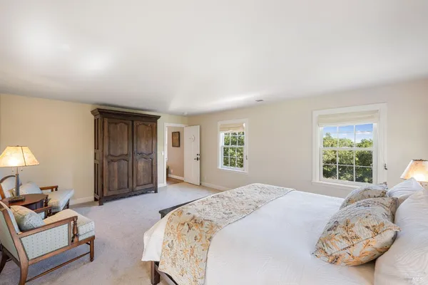 a bathroom with a granite countertop sink a mirror and a