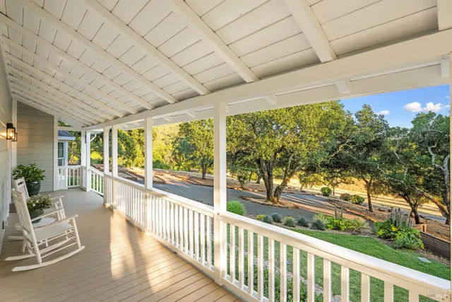 a view of a porch with wooden floor and outdoor space