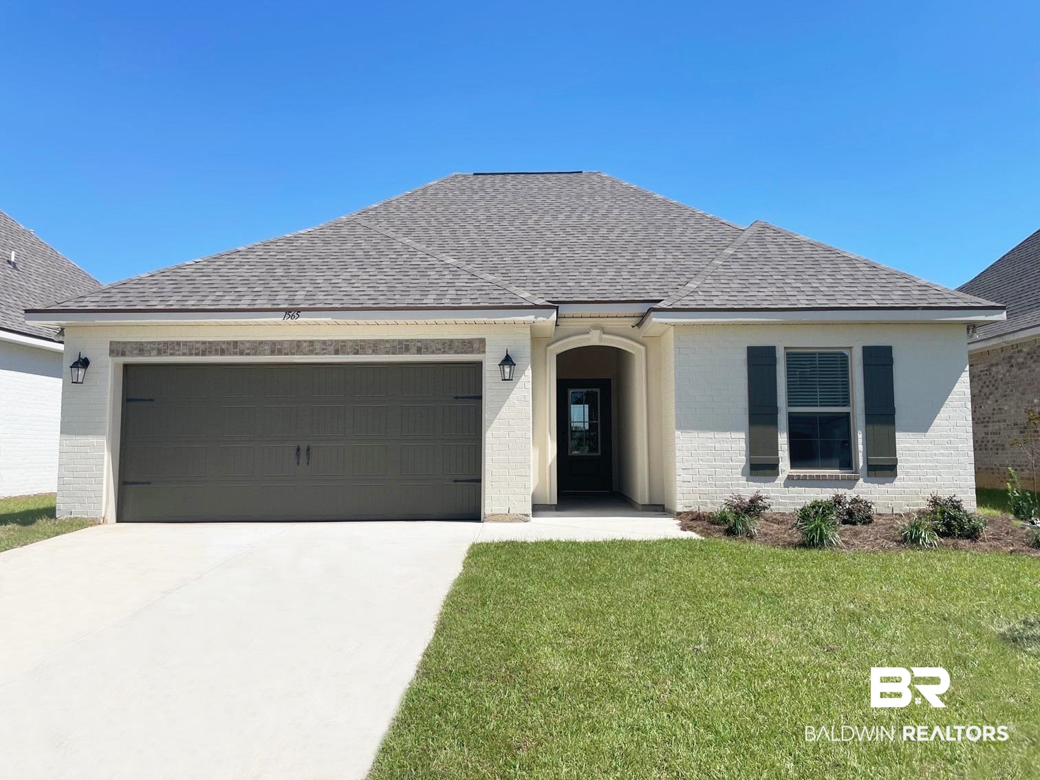 1565 Fenton Circle Foley, AL 36535 - Photo 1 of 15 View of front of property with a garage and a front lawn