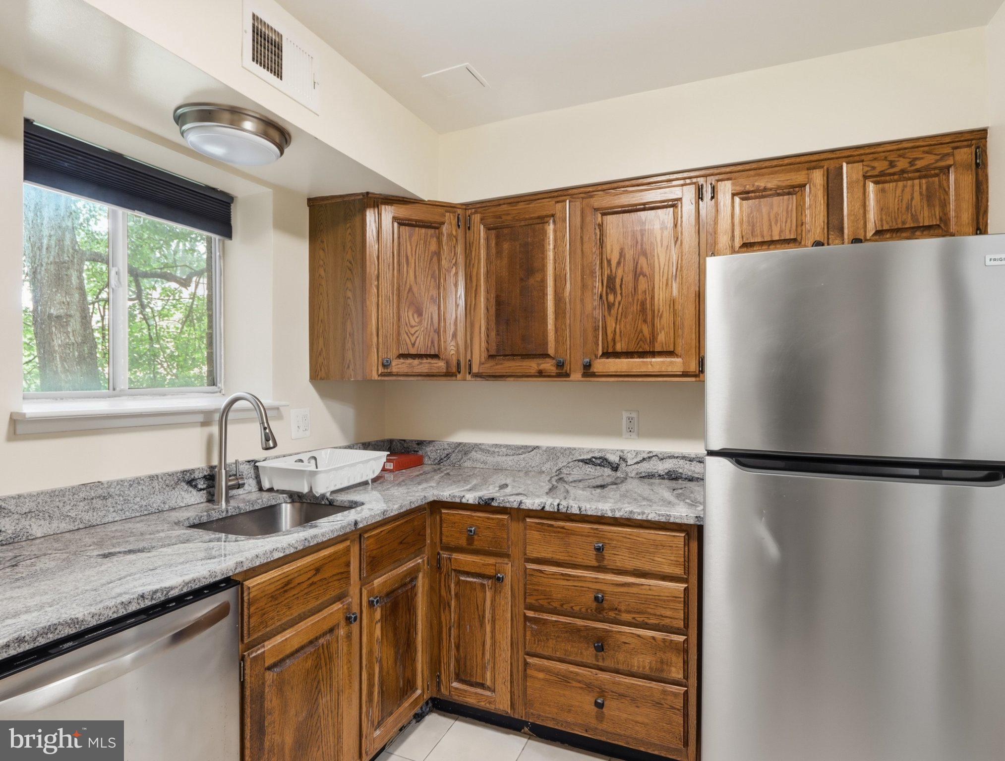 3204 Spartan Road, Unit 10 Olney, MD 20832 - Photo 11 of 31 Charming kitchen with natural light.