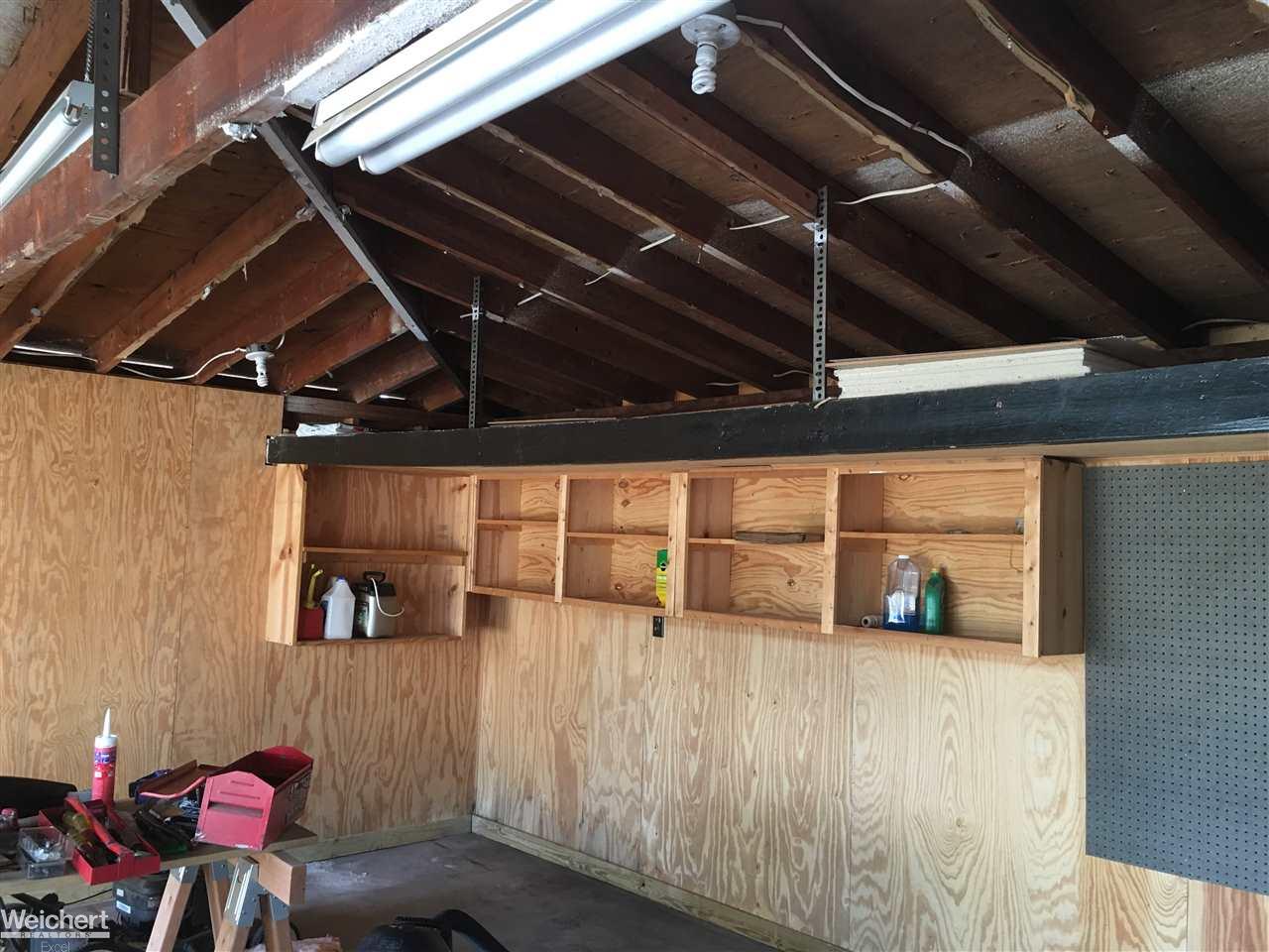 30505 Hayes Road Warren, MI 48088 - Photo 14 of 33 Garage is the perfect man cave! Many shelves for storage and electrical outlets throughout