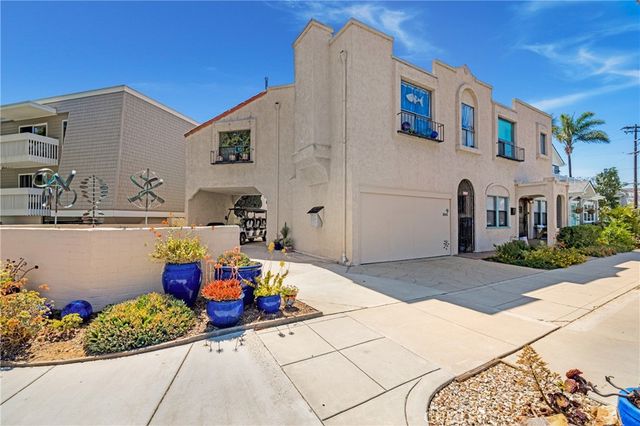 a front view of a house with outdoor seating
