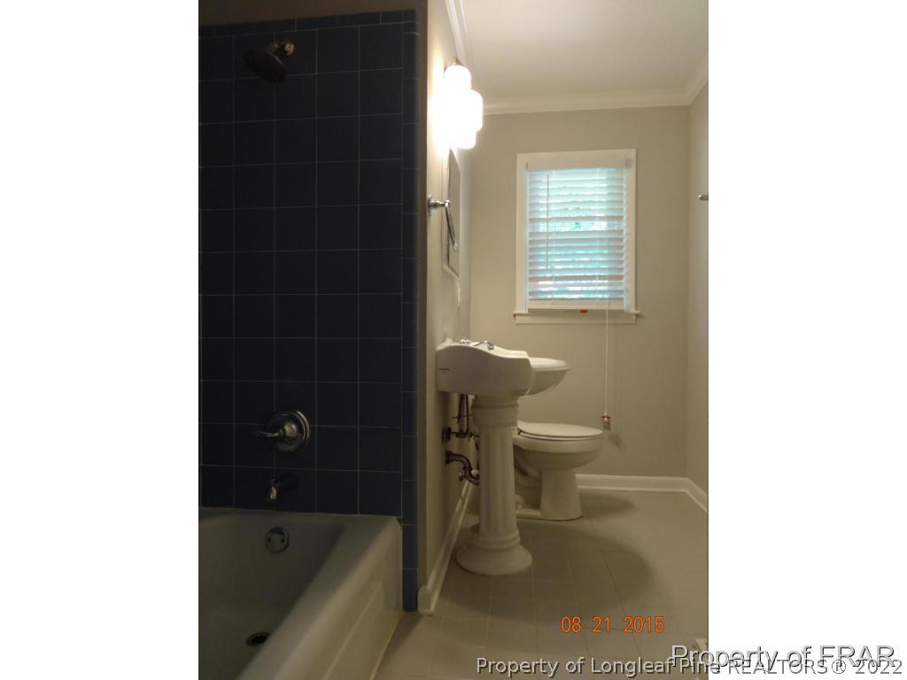 414 Lansdowne Road Fayetteville, NC 28314 - Photo 6 of 14 a bathroom with a toilet and a bathtub