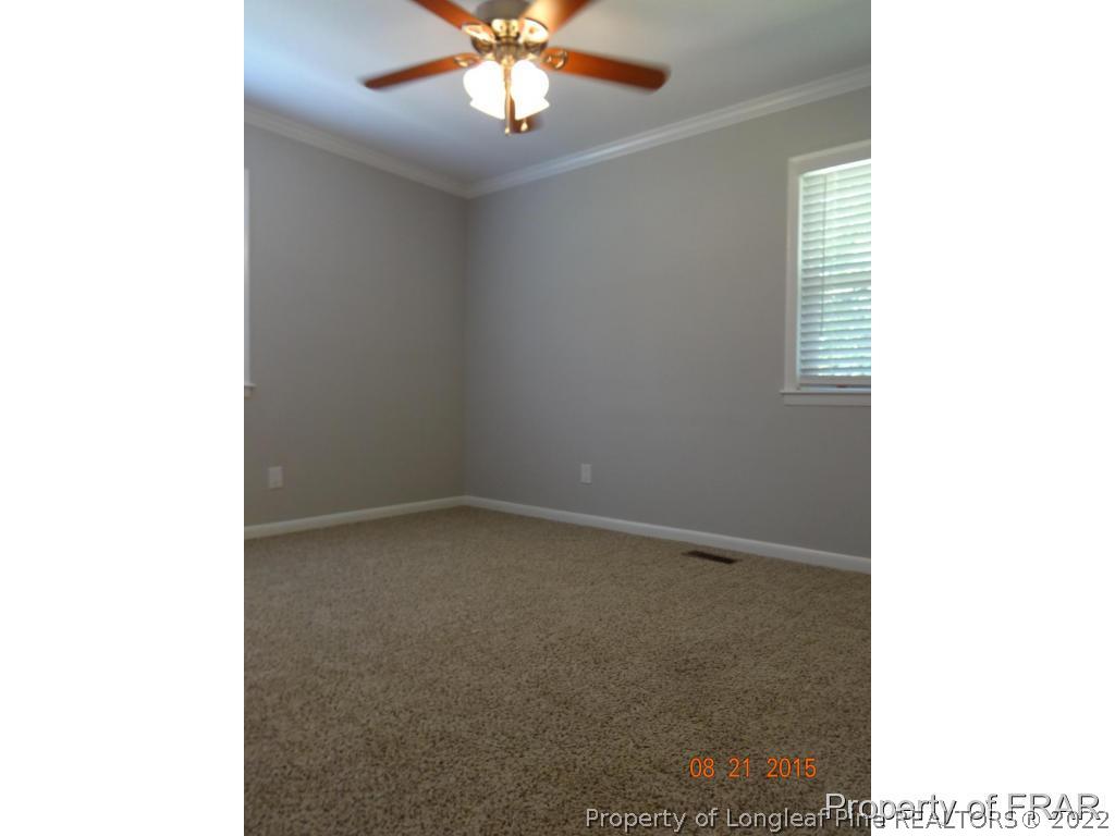 414 Lansdowne Road Fayetteville, NC 28314 - Photo 7 of 14 a view of an empty room with a window