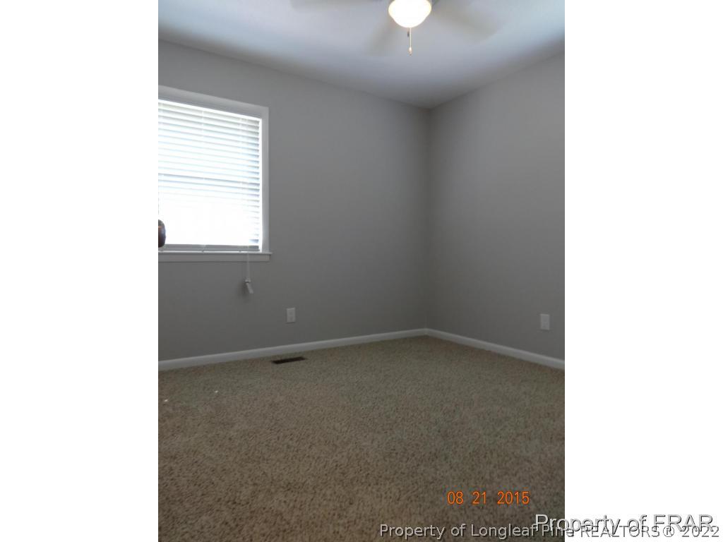 414 Lansdowne Road Fayetteville, NC 28314 - Photo 9 of 14 a view of an empty room with a window