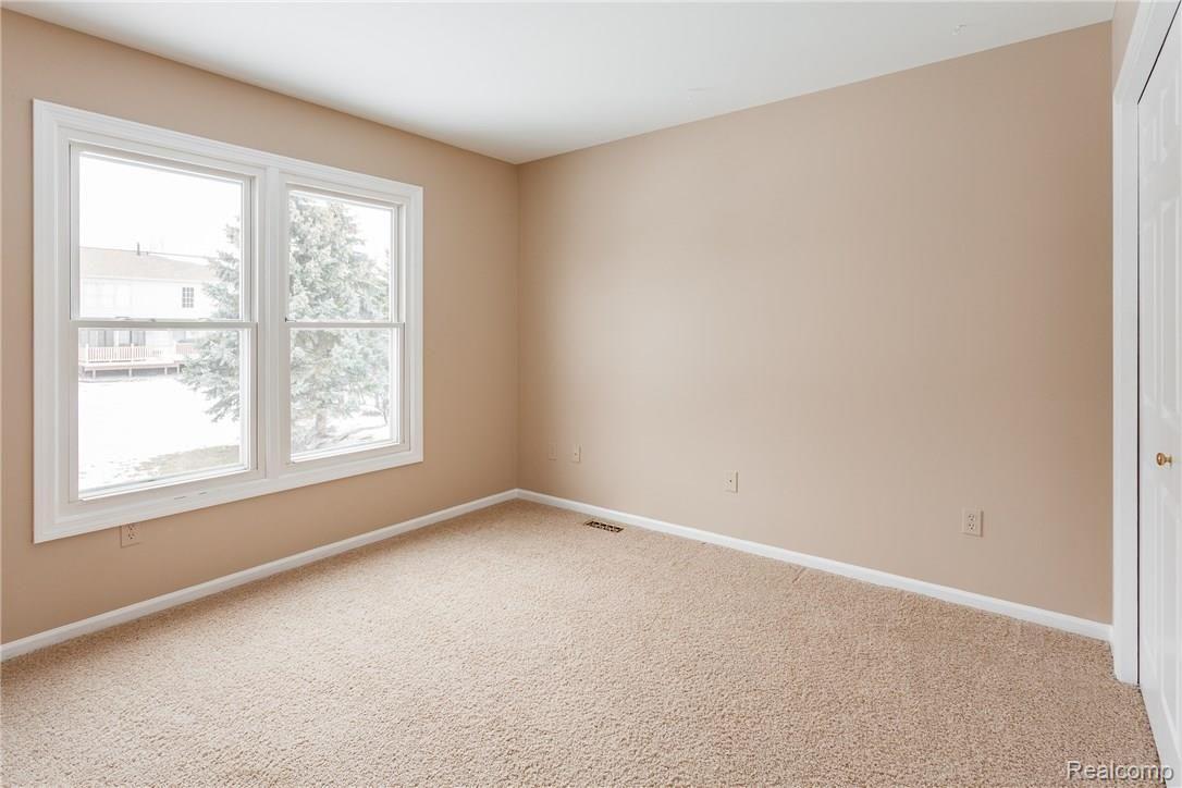 2360 Millbrook Court Rochester, MI 48306 - Photo 18 of 25 Bedroom 2 Overlooking the backyard
